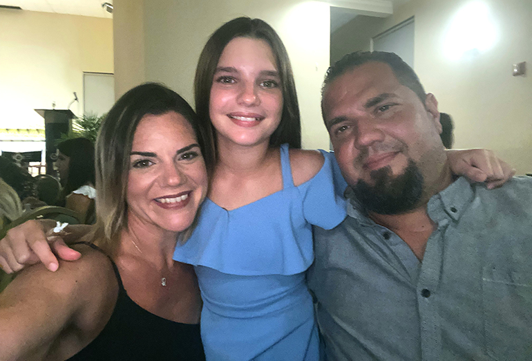 Jacqueline Mastrangelo, left, a graduate of Archbishop McCarthy High School, with her husband, Anthony, and their daughter, Gianna.