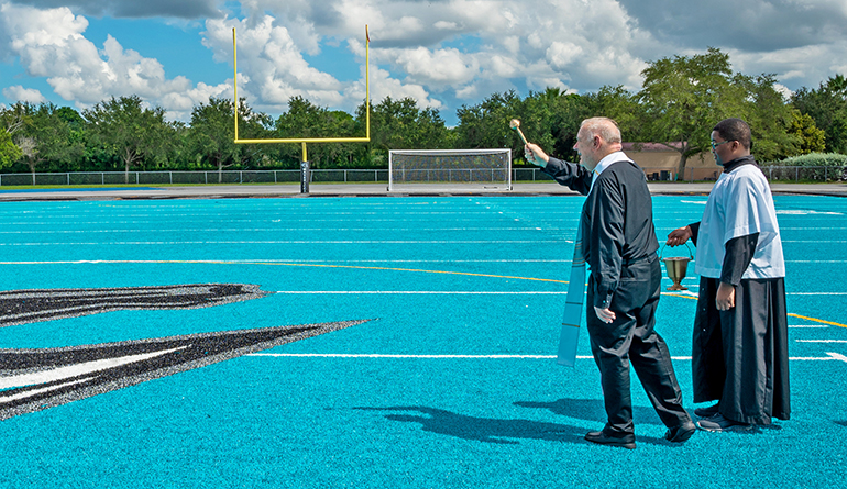 Archbishop Wenski blesses the new athletic field at Archbishop Edward A. McCarthy High School in Southwest Ranches Sept. 6, 2022.