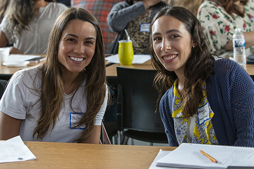 Michelle Ojeda, left, an elementary school assistant at Our Lady of the Lakes in Miami Lakes, and Annemarie Coniglio, a pre-K4 teacher at Nativity in Hollywood, were among the 250 new teachers - both new to teaching and/or new to archdiocesan Catholic schools - who were treated to a spirit-filled and inspiring orientation session Aug. 9, 2022, while gathered at Msgr. Edward Pace High School in Miami Gardens.