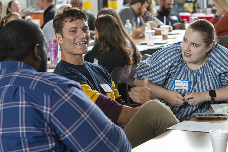 Participants talk about the reasons they chose to teach in Catholic schools during the orientation session held for around 250 new teachers - both new to teaching and/or new to archdiocesan Catholic schools - held Aug. 9, 2022, at Msgr. Edward Pace High School in Miami Gardens.