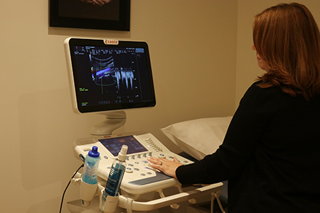 Ultrasound technician Maglia Carmenate, of the South Dade Pregnancy Help Center, checks out the ultrasound machine at the Central Broward Pregnancy Help Center in Fort Lauderdale, on the day it was blessed by Archbishop Thomas Wenski, Aug. 13, 2022.