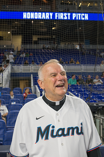 Archbishop Thomas Wenski smiles before throwing out the first pitch during Catholic Night at Loan Depot Park, before the start of the Miami Marlins-New York Mets game, Sept. 9, 2022.