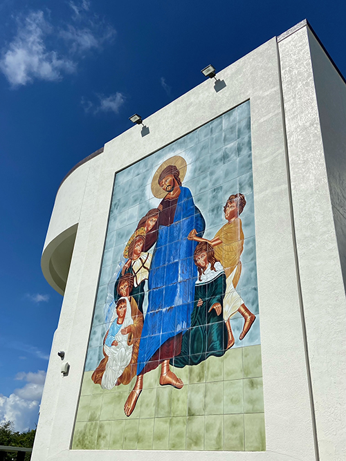 This iconographic mosaic on the east side of St. Louis Covenant's school building was created by the late parish artist Kevin Robson based on a holy card of Jesus with the children that the church's then pastor, now Msgr. James Fetscher, showed him. The school is marking its 30th anniversary this year.