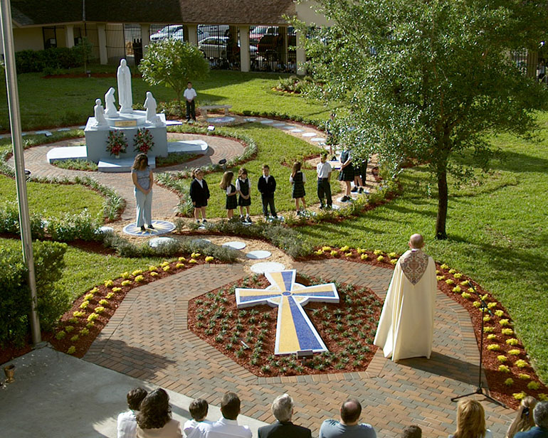 A rosary garden, donated by a parish family and completed in 2004, anchors the courtyard at Our Lady of the Lakes School in Miami Lakes.