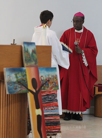 Bishop Charles Peters Barthélus of Port-de-Paix, Haiti, celebrates Mass at the Dante Navarro Chapel at Msgr. Edward Pace High in Miami Gardens on Sept. 14, 2022. Afterwards he toured the school and visited students and faculty, thanking them for supporting their sister schools in Haiti.