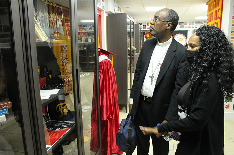 Bishop Charles Peters Barthélus of Port-de-Paix, Haiti, gets a tour of Heritage Hall at Msgr. Edward Pace High School in Miami Gardens on Sept. 14, 2022. Accompanying him is Pace teacher Mammone Onelien, who also served as translator during his visit. Port-de-Paix is the Archdiocese of Miami's sister diocese. Pace is one of several schools in the archdiocese that fundraises year-round to help schools and churches in Port-de-Paix.
