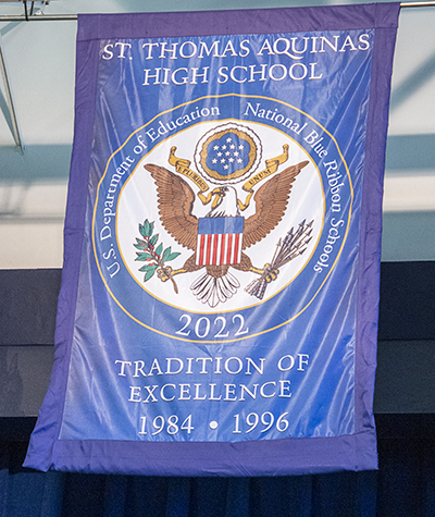 The banner announces St. Thomas Aquinas' 2022 Blue Ribbon designation as an Exemplary High Performing High School, Oct. 3, 2022. It was one of only two schools in Florida to earn the award, given to only 297 schools throughout the U.S. This is the third time St. Thomas has been awarded this distinction.