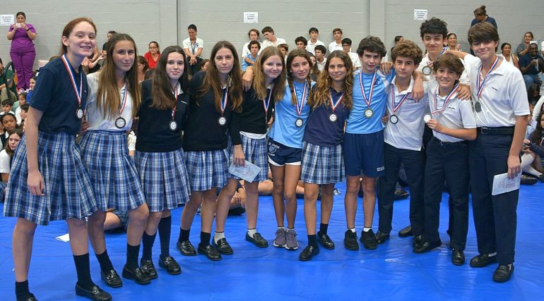 Eighth-graders at St. Agnes Academy buddy up for the recent Scholastic Olympics in Miami.