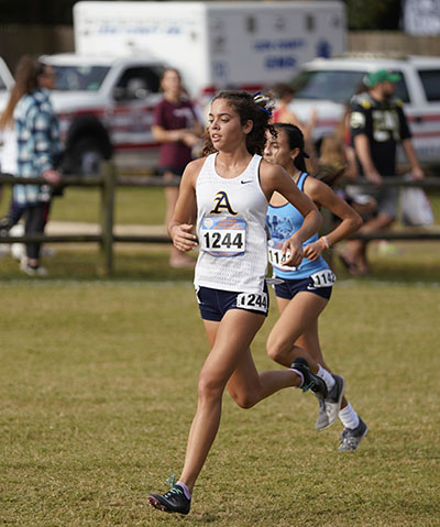 St. Thomas Aquinas' Grace Finnerman (#1244) runs toward a fourth place finish in Class 3A at the Florida High School Athletic Association's State Cross Country Championships, held Nov. 5, 2022 in Tallahassee. Behind her is fifth place finisher Olivia Fraga (#1142) from Our Lady of Lourdes Academy in Miami.