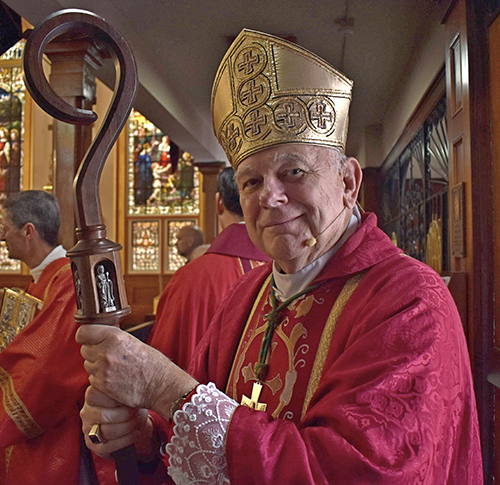 Archbishop Thomas Wenski pauses before the procession starting the 2022 Red Mass, Dec. 1, 2022  at Gesu Church, Miami.