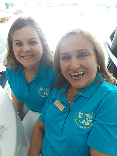 Heart, Hope and Home ministry's Rosie Lacayo-Perez and Maria Jacques smile for the camera at the Florida Faith-Based and Community-Based Advisory Award Breakfast, Oct. 1, 2022