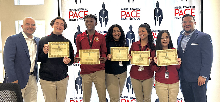 Msgr. Edward Pace High alumni and donors Jesus Tundidor, far left, and James Tundidor Jr., far right, pose with Tundidor Family Scholarship recipients Christian Del Pino, Brian Jones, Oprah Martinez, Naomi Castaneda and Abby Garcia, Nov. 1, 2022.