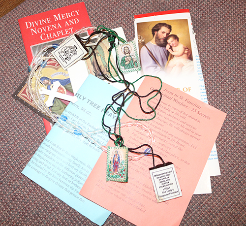 Items including rosary beads and prayer cards were available to those attending the first night of the inaugural Rosary Congress, Dec. 2, 2022 at St. Gabriel Church in Pompano Beach. The Rosary Congress traveled to six different parishes in the Archdiocese of Miami Dec. 2-8.