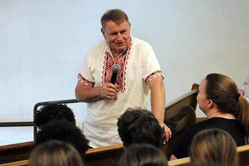 Children's author Michael Sampson answers questions from middle school students at St. Louis Covenant School on April 29, 2022 about his work as a Fulbright Scholar in Ukraine, which turned into humanitarian work with refugees fleeing from the country.