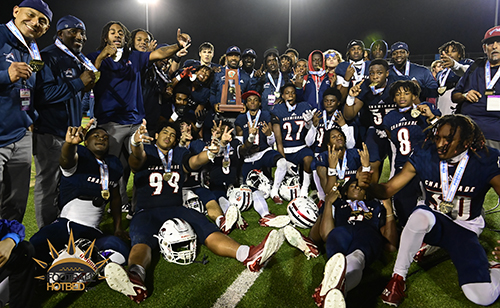 Chaminade-Madonna players celebrate the Hollywood high school's second straight state championship after defeating Clearwater Central Catholic in the Class 1M game by a score of 48-14, Dec. 8, 2022 in Tallahassee.