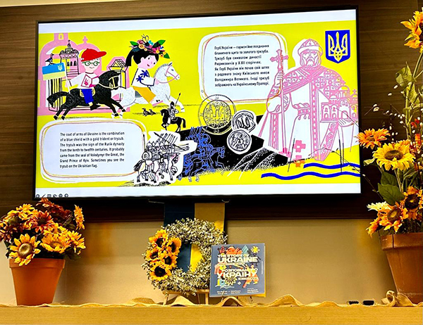The illustrations in Michael Sampson's "The Story of Ukraine" depict the history of Ukraine, its coat of arms, and more. Sampson, along with his wife and coauthor Olena Kharchenko, visited St. Louis Covenant School in December 2022 to share the book with students.