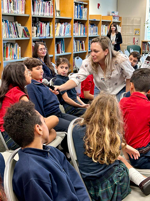 Ukrainian author Olena Kharchenko takes questions from students at St. Louis Covenant School in December 2022. Kharchenko's husband, Michael Sampson, is an American award-winning author, educator, and Fulbright Scholar. Together they penned “The Story of Ukraine,” a children's book highlighting the country's history, customs, and more.