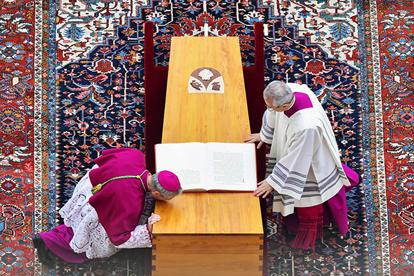 Archbishop Georg Ganswein, private secretary to Pope Benedict XVI, kisses the casket of the late pope during his funeral Mass in St. Peter's Square at the Vatican Jan. 5, 2023. Also pictured is Msgr. Diego Giovanni Ravelli, Pope Francis' master of papal liturgical ceremonies. (CNS photo/Vatican Media)
