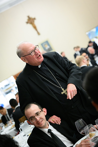 Cardinal Timothy Dolan of New York greets seminarians and other guests before speaking about "Used-to-be Catholicism" Jan. 19, 2023, at St. Vincent de Paul Regional Seminary in Boynton Beach, Florida.