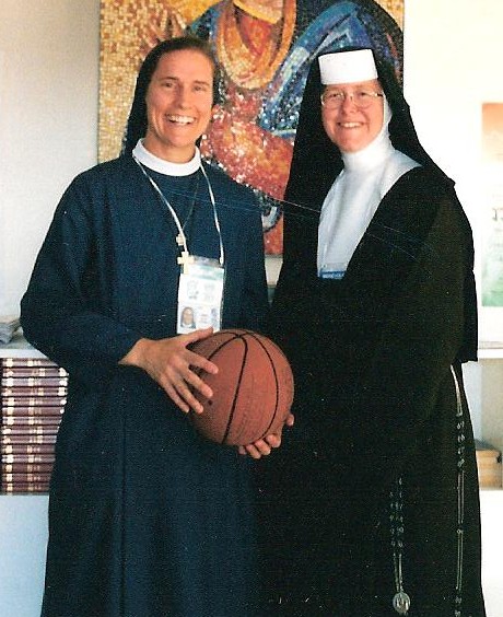 Sister Irene Regina, left of the Daughters of St. Paul, and Sister Margaret Ann Laechelin, of the Carmelites of the Most Sacred Heart of Los Angeles, shared their story of basketball, friendship and religious vocation at the 2002 World Youth Day in Toronto. They especially recalled one special moment when they both sat before the tabernacle in the dimly lit college chapel one evening after practice and prayed together.