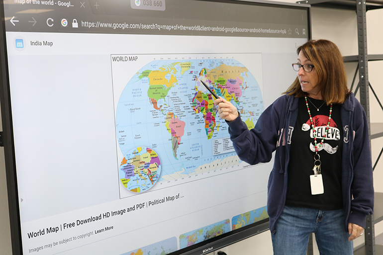 St. Coleman School STREAM teacher Patricia O'Connor gives her students a lesson on different destinations of the world, taking them to visit various areas with the help of  modern technology.