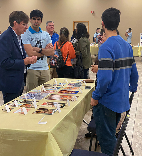 Dr. Steven A. Christie chats with students who attended his "Speaking for the Unborn" talk, hosted by FIU Catholic Panthers at St. Agatha Parish Hall, Jan.21, 2023.