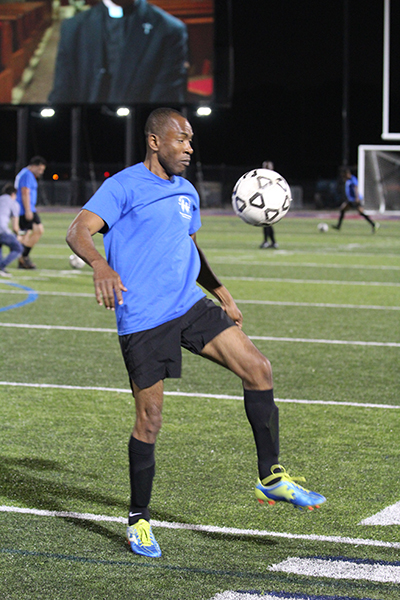 Father Fritzner Bellonce, pastor of Holy Family in North Miami, warms up before the game. Archdiocesan seminarians defeated the priests 3-0 in the inaugural Archbishop's Cup soccer game, played Feb. 3, 2023 on the field at St. Thomas University, Miami Gardens.