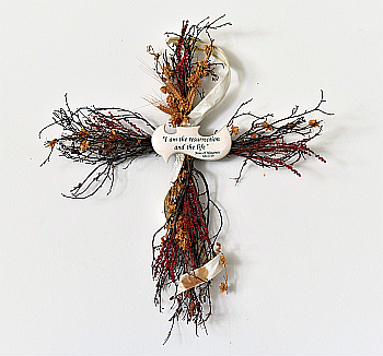 Dried flowers form a cross in the parish hall.