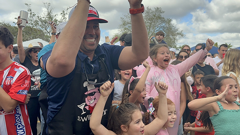 2023 VIP Judge’s Choice winner, Swine Bar, celebrate their big win at St. Theresa School in Coral Gables' Pig-Nic, held Jan. 29, 2023.