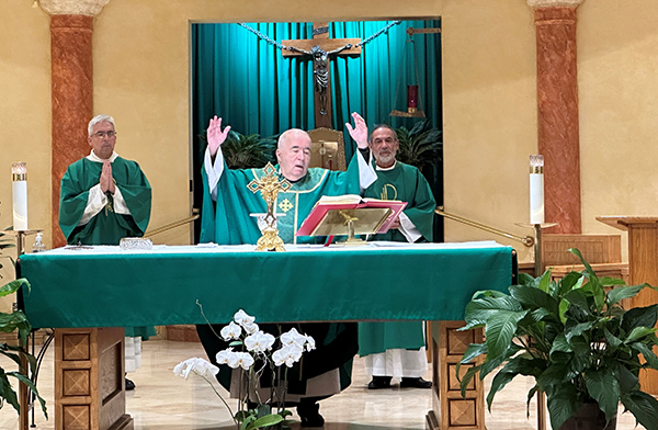 Jesuit Father Eddie Alvarez celebrates the Mass marking the 50th anniversary of Impactos de Cristiandad, a movement built around retreats the whole family can attend. The celebration took place Feb. 11, 2023 at Blessed Trinity Church in Miami Springs.
