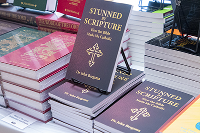 Books by theologian John Bergsma on display at the church during the conference "The Eucharist: Our Source and Summit," held March 4, 2023.