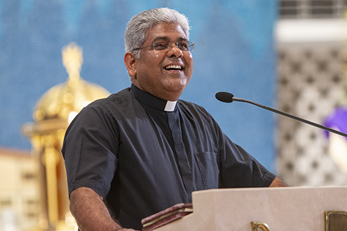 Father George Packuvettithara, pastor of St. Rose of Lima, Miami Shores, welcomes participants to the conference on "The Eucharist: Our Source and Summit," March 4, 2023.