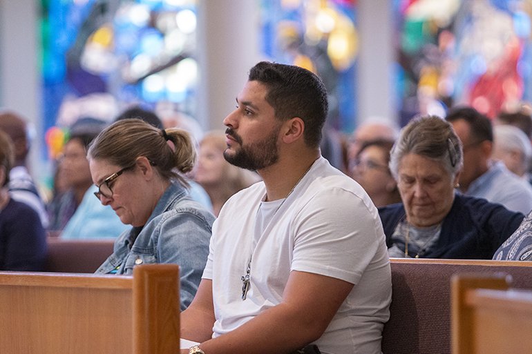 Parishioners and others listen to Biblical theologian Scott Hahn speak at the conference on "The Eucharist: Our Source and Summit," held March 4, 2023 at St. Rose of Lima Church, Miami Shores.