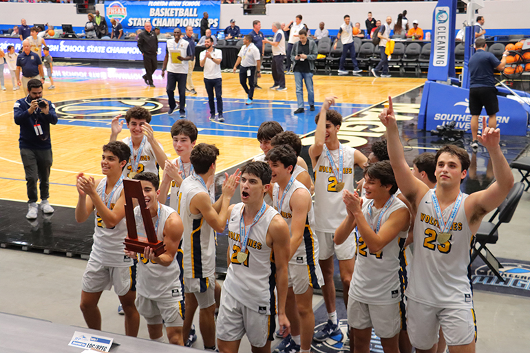 Belen Jesuit Prep's varsity basketball celebrates their historic first championship in the sport after defeating Daytonaâ€™s Mainland 49-30 in the Class 5A final, played March 4, 2023 at the RP Funding Center in Lakeland. The Wolverines, coached by Gaston "Chachi" Rodriguez, ended the season with a 28-4 record.