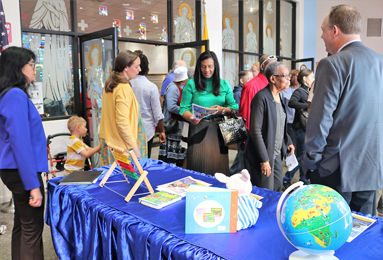 Jim Rigg, archdiocesan secretary of Education and superintendent of Schools, answers questions and hands out information about the soon-to-reopen St. Malachy School after Masses March 5, 2023 at St. Malachy Church in Tamarac.