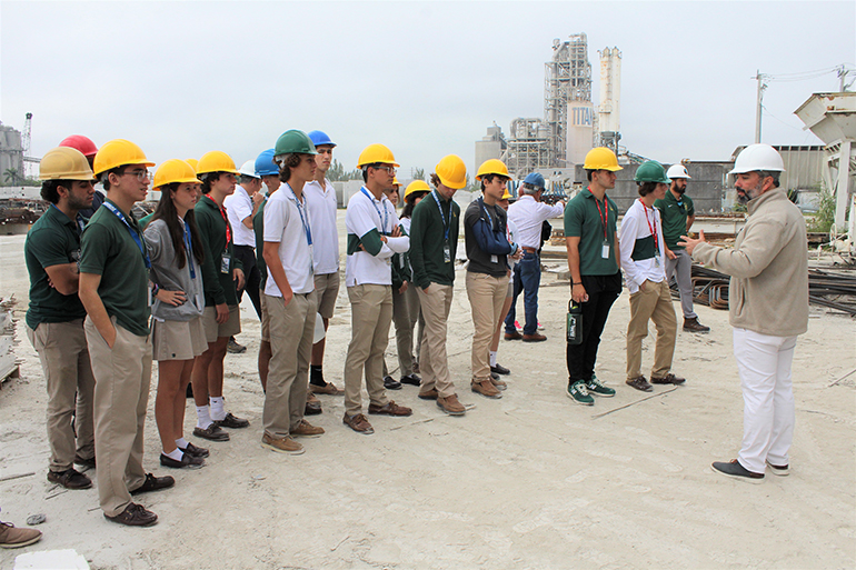 Luis Compres, project consultant at Coreslab Structures in Medley, leads students and teachers from Immaculata-La Salle High's STEAM engineering program on a tour of the grounds of Coreslab, Nov. 17, 2022. Coreslab is a leading producer of precast/prestressed concrete products and part of the construction team building Immaculata-La Salle's new athletic facilities.
