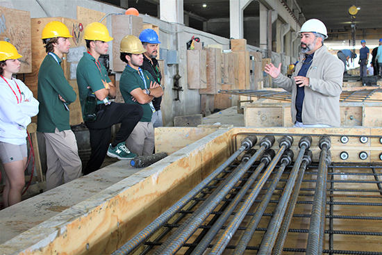 Luis Compres, project consultant at Coreslab Structures in Medley, leads students from Immaculata-La Salle High's STEAM engineering program on a tour of the grounds of Coreslab Nov. 17, 2022. Coreslab is a leading producer of precast/prestressed concrete products and part of the construction team building Immaculata-La Salle's new athletic facilities.