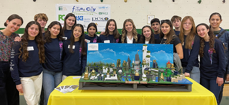Eighth graders from St. Hugh School in Miami competed and placed first in the Future City regional contest in Tampa Bay in January 2023. With their project, Imperium-Aqua, the group moved on to the international level of competition held in Washington, D.C. and placed fourth. In the photo, from left to right, are science teacher Emily Concepcion and her students Emily Triana, Marco Law, Nora Roca, Ana Pantin, Aaliyah Figueroa, Catalina Betancourt, Cecilia Santa-Cruz, Anna Vieria, Carolina Nunez-Menocal, Leman Oliveros, Isabella Lopez, Luke Rodriguez, Victoria Volum, Rebecca Hernandez, and adult mentor Cristina Santa-Cruz.