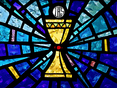 Consecrated bread hovers over the Eucharistic chalice, stamped with IHS, an abbreviation for "By This Sign, Conquer." King Constantine is said to have seen the symbols in a vision before a pivotal battle that he won.