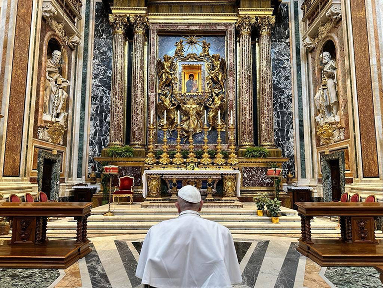 Pope Francis prays before the icon of Mary, "Salus Populi Romani," in the Basilica of St. Mary Major in Rome April 1, 2023, after being released from Rome's Gemelli hospital for treatment of bronchitis. The Vatican said he entrusted to Mary the children he met in the hospital, all the sick and those mourning the loss of loved ones. (CNS photo/Holy See Press Office)