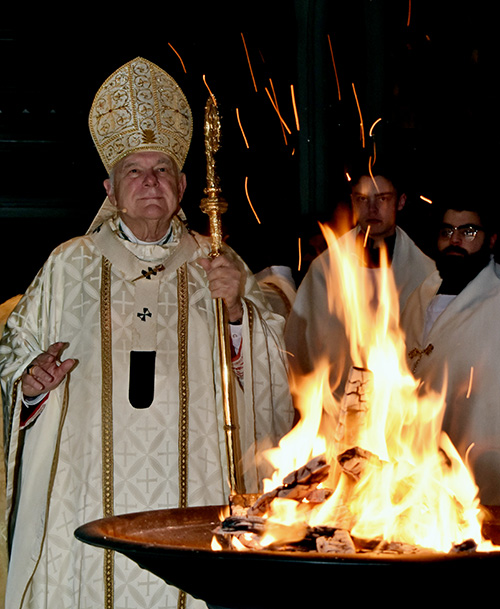 Archbishop Wenski blesses the New Fire at the Easter Vigil Mass at St. Mary Cathedral, April 9, 2023.