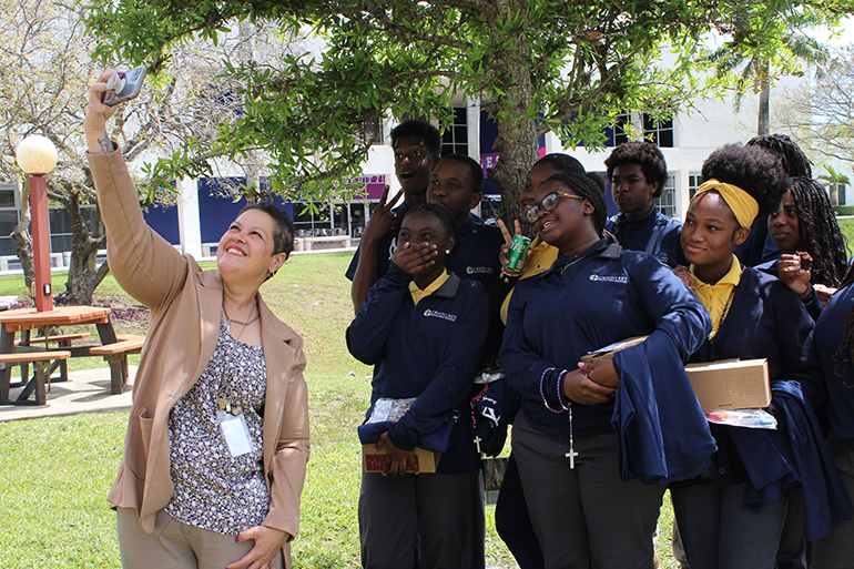 March 22, 2023
MIAMI GARDENS
Brunilda Egan, campus ministry director at Cristo Rey High School in North Miami, takes a selfie with her students on the grounds of St. Thomas University. On March 22, 2023 St. Thomas University welcomed high schools from the Archdiocese of Miami for a kick off gathering for the National Eucharistic Revival, featuring guest speaker Katie Prejean McGrady.