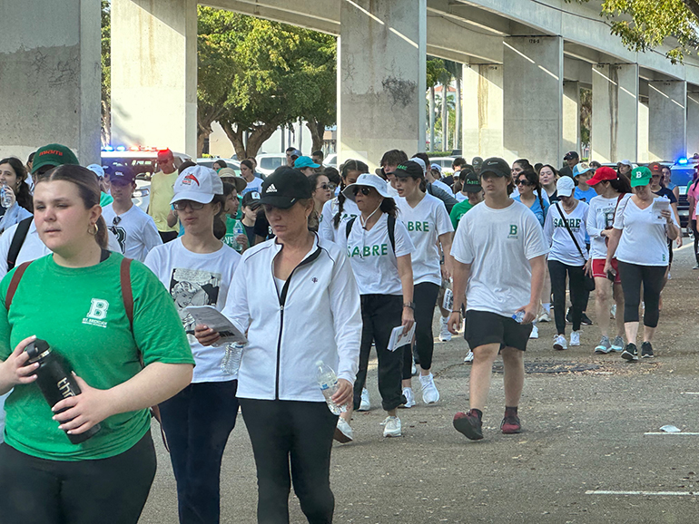 St. Brendan High students and parents participate in the six-mile Via Crucis from St. Augustine Church in Coral Gables to the Shrine of Our Lady of Charity, April 1, 2023.