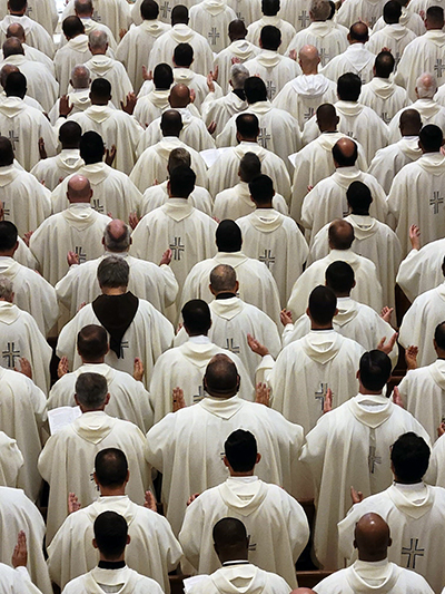 A sea of priests - nearly 300 were in attendance - can be seen from the choir loft of St. Mary Cathedral during the chrism Mass, April 4, 2023.