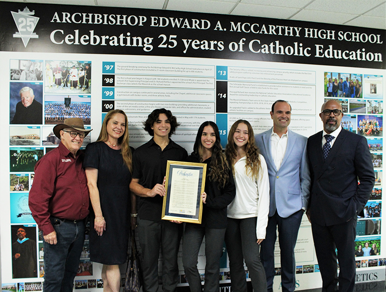 Archbishop Edward A. McCarthy High unveiled a 25th anniversary timeline of their school's history on April 27, 2023 created by student siblings Sophia, Susanna and Christopher Inguanzo. Broward County also declared the date as "Archbishop Edward A. McCarthy High School Day." Present for the ceremony and in this photo are Southwest Ranches Vice Mayor Jim Allbritton, Gina Inguanzo, Christopher Inguanzo, Sophia Inguanzo, Susanna Inguanzo, Ramiro Inguanzo, and Archbishop McCarthy Principal Richard Jean.