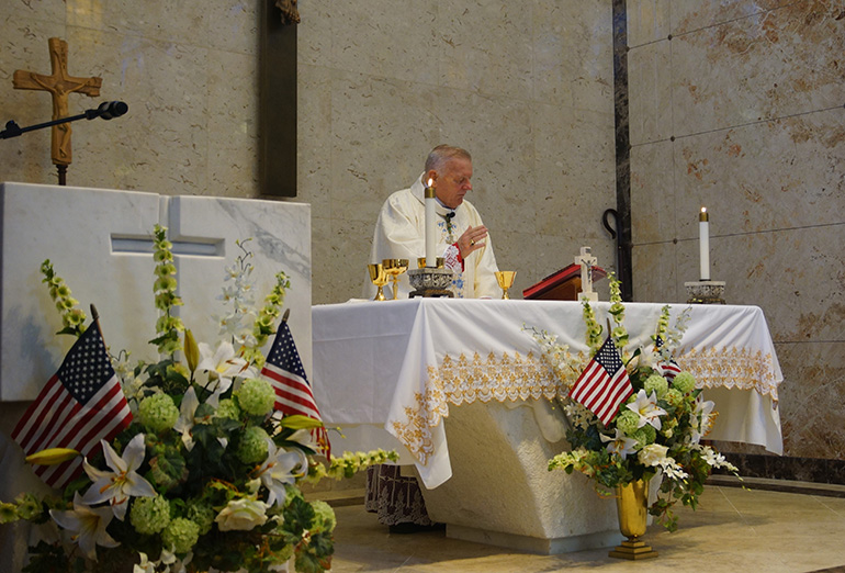 Archbishop Thomas Wenski celebrates the Memorial Day Mass at Our Lady Queen of Heaven Cemetery in North Lauderdale, May 29, 2023.