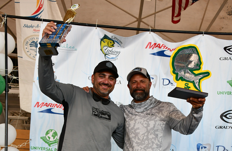 Top prize winners: “All-State Contractors” team captain Mario Chaluja, second prize, poses with “Off Limits” team captain Mike Murias, first prize, at St. Theresa School's 2023 Fishing Tournament, held May 20, 2023.
