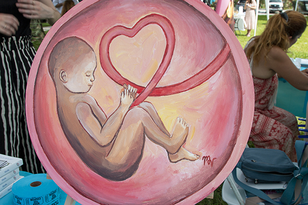 Young artist Maria Villa hand-painted this pro-life canvas as a prize for the Life Collective Raffle fundraiser supporting the Archdiocese of Miami Respect Life Ministry.
Life Collective was a pro-life art exhibition at Our Lady of Lourdes Church in Miami, May 21, 2023.