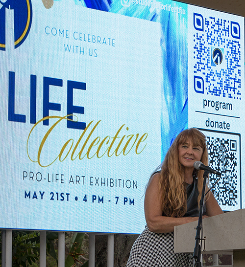 Tewannah Aman, executive director of Broward Right to Life, speaks about her abortion and conversion at Life Collective, a pro-life art exhibition at Our Lady of Lourdes Church in Miami, May 21, 2023.
