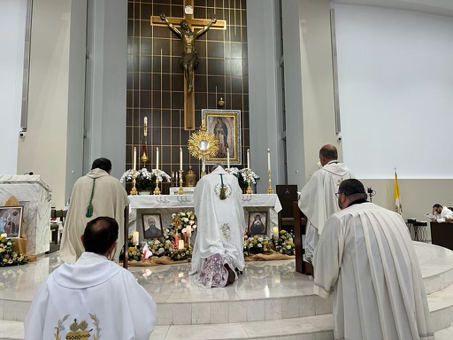 Archbishop Thomas Wenski and concelebrating bishops and priests pray before the Blessed Sacrament at the conclusion of the opening Mass of  the annual Great Vigil marking the feasts of the Sacred Heart of Jesus and the Immaculate Heart of Mary, which took place the evening of June 16 through the morning of June 17, 2023.